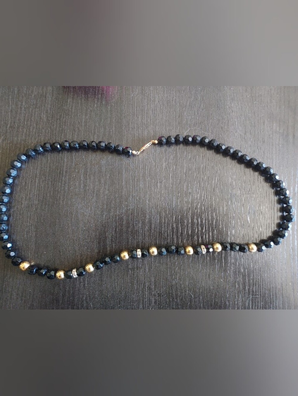 Elegant Black Beaded Necklace with Gold Accent Beads